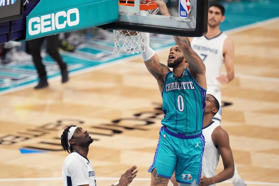 Charlotte Hornets forward Miles Bridges (0) goes up for a dunk against the Memphis Grizzlies during the second quarter at Spectrum Center in Charlotte on Feb. 10, 2024.