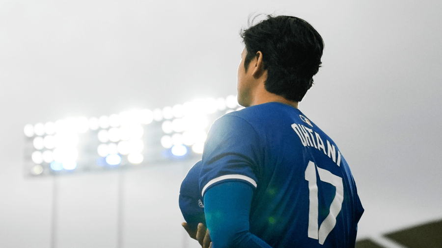 Los Angeles Dodgers designated hitter Shohei Ohtani stands as the national anthem plays before a spring training baseball game against the Los Angeles Angels in Los Angeles on March 24, 2024.