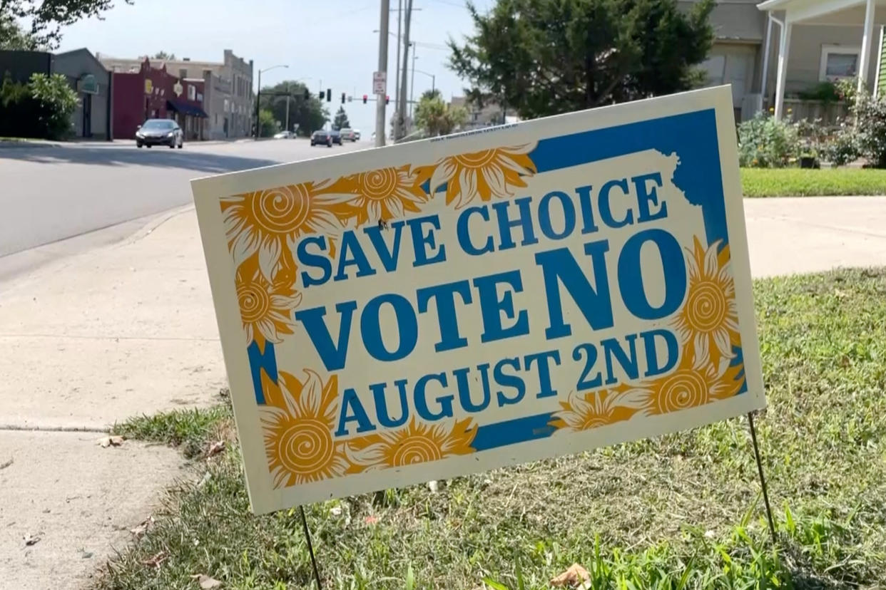 A sign urging voters to reject a state constitutional amendment declaring there is no right to abortion is seen during the primary election and abortion referendum at a Wyandotte County polling station in Kansas City, Kan., on Aug. 2. 