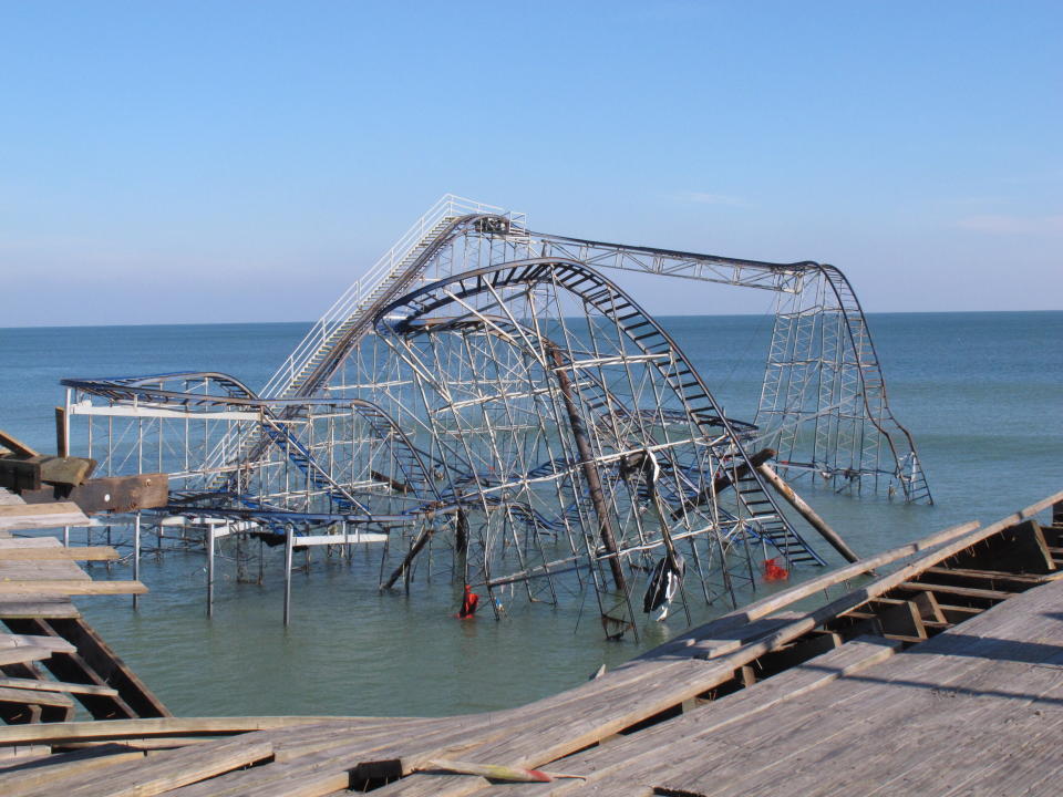 This Nov. 29, 2012 file photo shows the Jet Star roller coaster sitting in the ocean in Seaside Heights N.J. one month after Superstorm Sandy knocked it off Casino Pier into the water. On the 10th anniversary of the storm, government officials and residents say much has been done to protect against the next storm, but caution that much more still needs to be done to protect against future storms. (AP Photo/Wayne Parry)