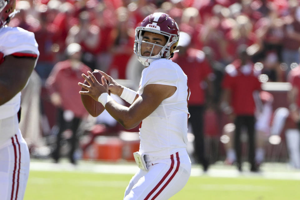 Alabama quarterback Bryce Young (9) drops back to pass against Arkansas during the first half of an NCAA college football game Saturday, Oct. 1, 2022, in Fayetteville, Ark. (AP Photo/Michael Woods)