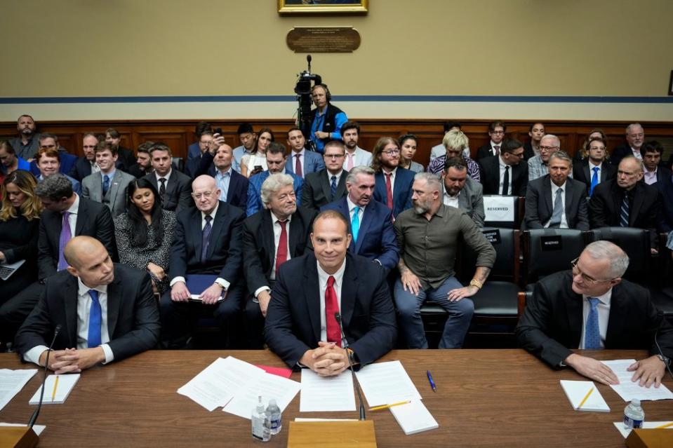 Ryan Graves, executive director of Americans for Safe Aerospace, David Grusch, former National Reconnaissance Officer Representative of Unidentified Anomalous Phenomena Task Force at the Department of Defense, and Retired Navy Commander David Fravor take their seats as they arrive for a House Oversight Committee hearing titled "Unidentified Anomalous Phenomena: Implications on National Security, Public Safety, and Government Transparency" on Capitol Hill in Washington on July 26.<span class="copyright">Drew Angerer—Getty Images</span>