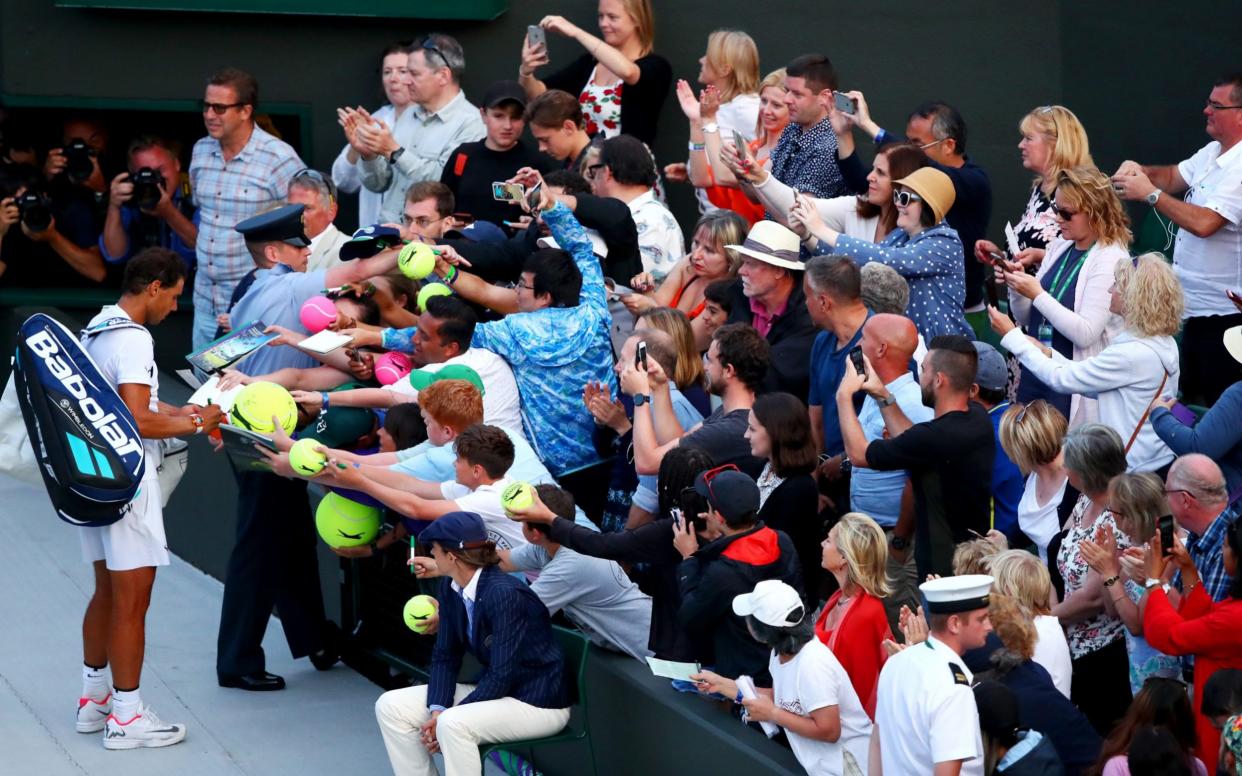 Large numbers of people remained in the Wimbledon grounds late into the evening on Monday after Nadal's epic match against Muller - Getty Images Europe