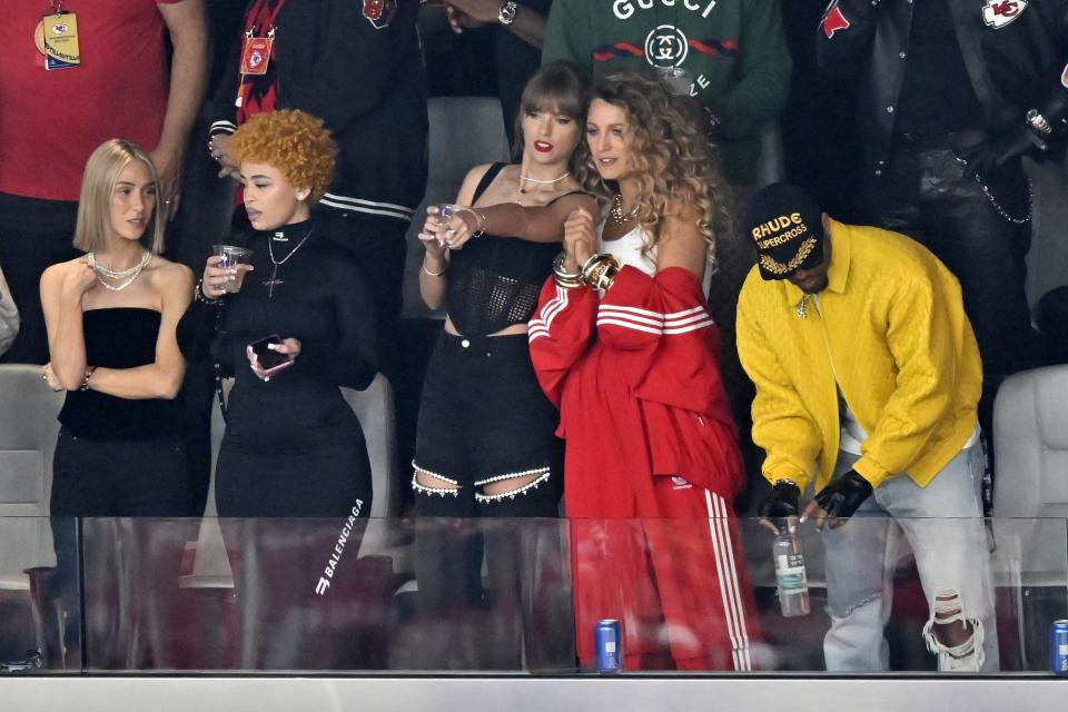 Ashley Avignone, from left, Ice Spice, Taylor Swift and Blake Lively talk before the NFL Super Bowl 58 football game between the San Francisco 49ers and the Kansas City Chiefs on Sunday, Feb. 11, 2024, in Las Vegas. (AP Photo/David Becker)