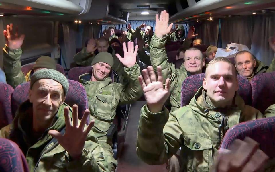 A group of Russian servicemen arrive after a prisoners of war (POW) exchange, at Chkalovsky military airport