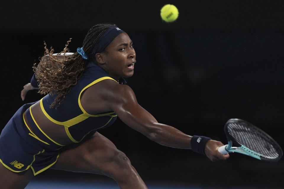 Coco Gauff of the U.S. plays a backhand return to Aryna Sabalenka of Belarus during their semifinal match at the Australian Open tennis championships at Melbourne Park, Melbourne, Australia, Thursday, Jan. 25, 2024. (AP Photo/Andy Wong)