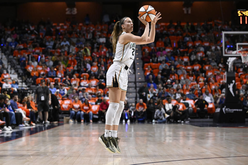 FILE - New York Liberty guard Sabrina Ionescu shoots a 3-point basket during the first half of Game 3 of a WNBA basketball semifinal playoff series against the Connecticut Sun, Sept. 29, 2023, in Uncasville, Conn. All-Star Saturday Night, Feb. 17, 2024, gets an event like never before: Sabrina Ionescu vs. Stephen Curry, in a 3-point battle of the sexes. (AP Photo/Jessica Hill, File)