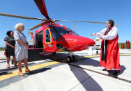 Bishop of Truro the Right Reverend Philip Mounstephen blesses the helicopter, during a visit by the Duchess of Cornwall to the Cornwall Air Ambulance Trust to launch the new "Duchess of Cornwall" helicopter.