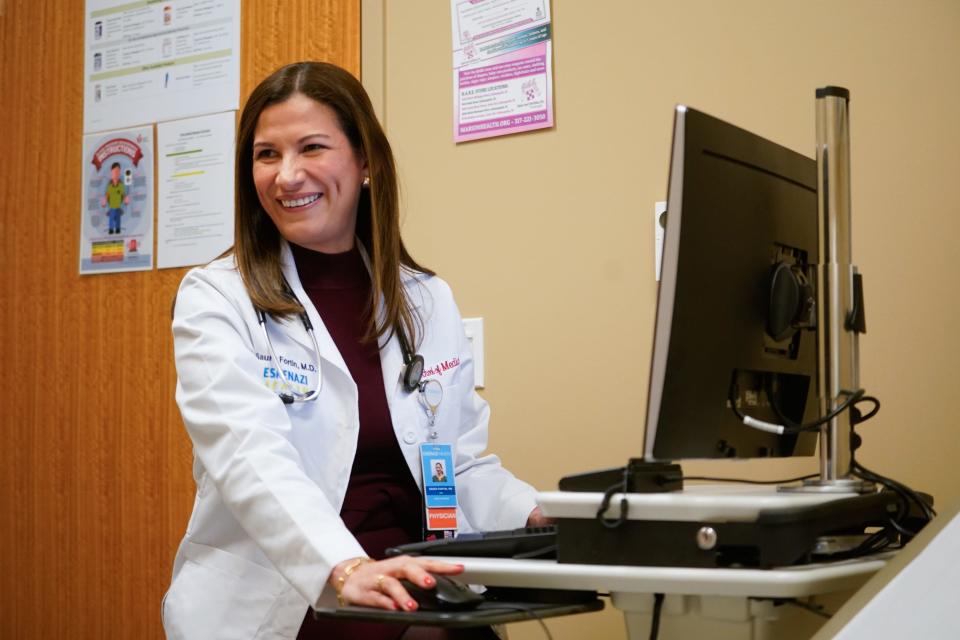 Saura Fortin Erazo, M.D. sees a patient in Primary Care on Tuesday, Dec. 12, 2023, at Sidney & Lois Eskenazi Hospital in downtown Indianapolis. As an Eskenazi Health provider, Fortin Erazo also staffs the urgent care clinic.