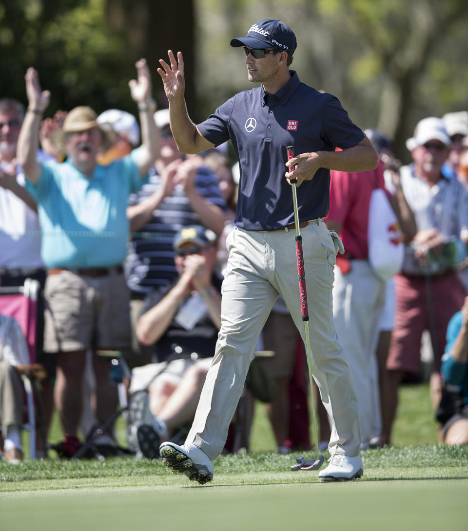 Adam Scott waves to the crowd after he birdied the seventh hole during the first round of the Arnold Palmer Invitational golf tournament at Bay Hill Thursday March 20, 2014, in Orlando, Fla. (AP Photo/Willie J. Allen Jr.)