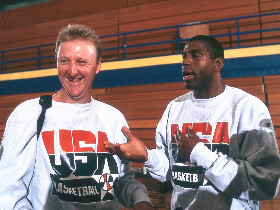 Larry Bird and Magic Johnson talk to reporters after a Dream Team practice in 1992.