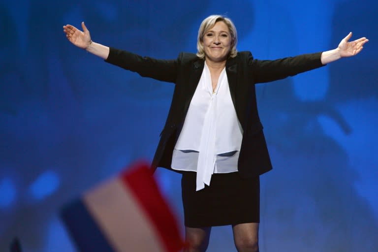 French far-right Front National (FN) party candidate for the presidential election Marine Le Pen waves as she arrives to speak on stage during a campaign rally at the Zenith de Nantes venue in Saint-Herblain on February 26, 2017