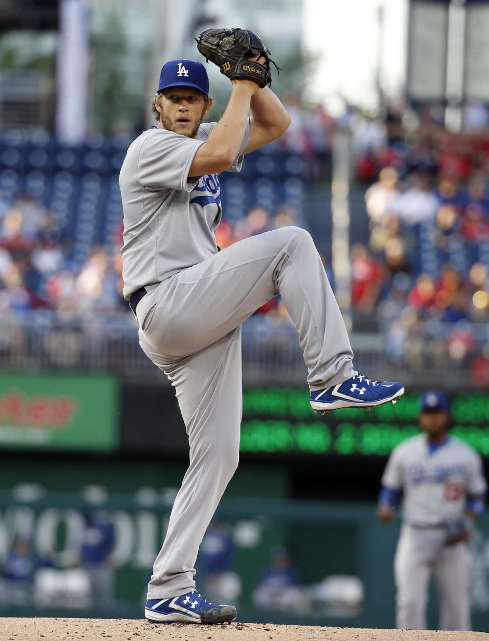 Los Angeles Dodgers starting pitcher Clayton Kershaw throws during the first inning of a baseball game against the Washington Nationals at Nationals Park, Tuesday, May 6, 2014, in Washington. (AP Photo/Alex Brandon)
