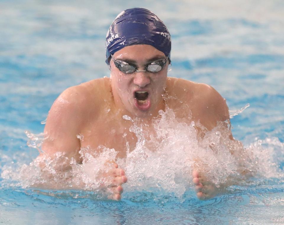 Hudson's Vittorio Cappabianca swims the breast stroke leg of the 200 yard IM in the Division I Sectional Championships on Saturday, Feb. 11, 2023 in Akron, Ohio, at the University of Akron's Ocasek Natatorium.