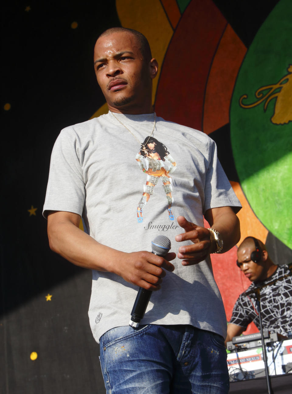 FILE - This May 2, 2015 file photo shows T. I. performing at the New Orleans Jazz & Heritage Festival in New Orleans. Motivated by the deaths of two young black men in Minnesota and Louisiana, Tip released the EP "Us or Else" which focuses on the issues of social justice and police brutality. (Photo by John Davisson/Invision/AP, File)