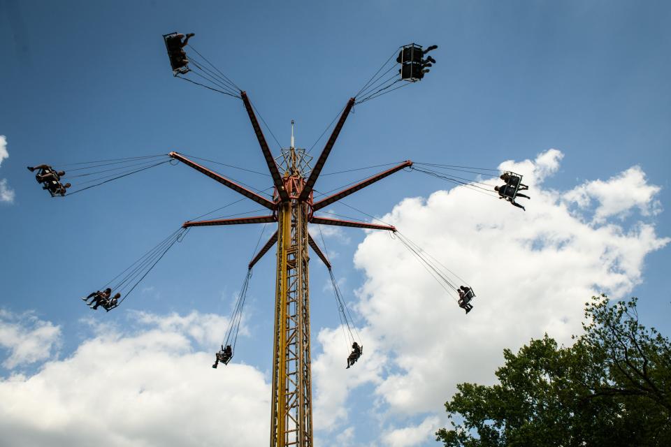 Dogwood Festival attendees enjoy a carnival ride Saturday, April 23, 2022.