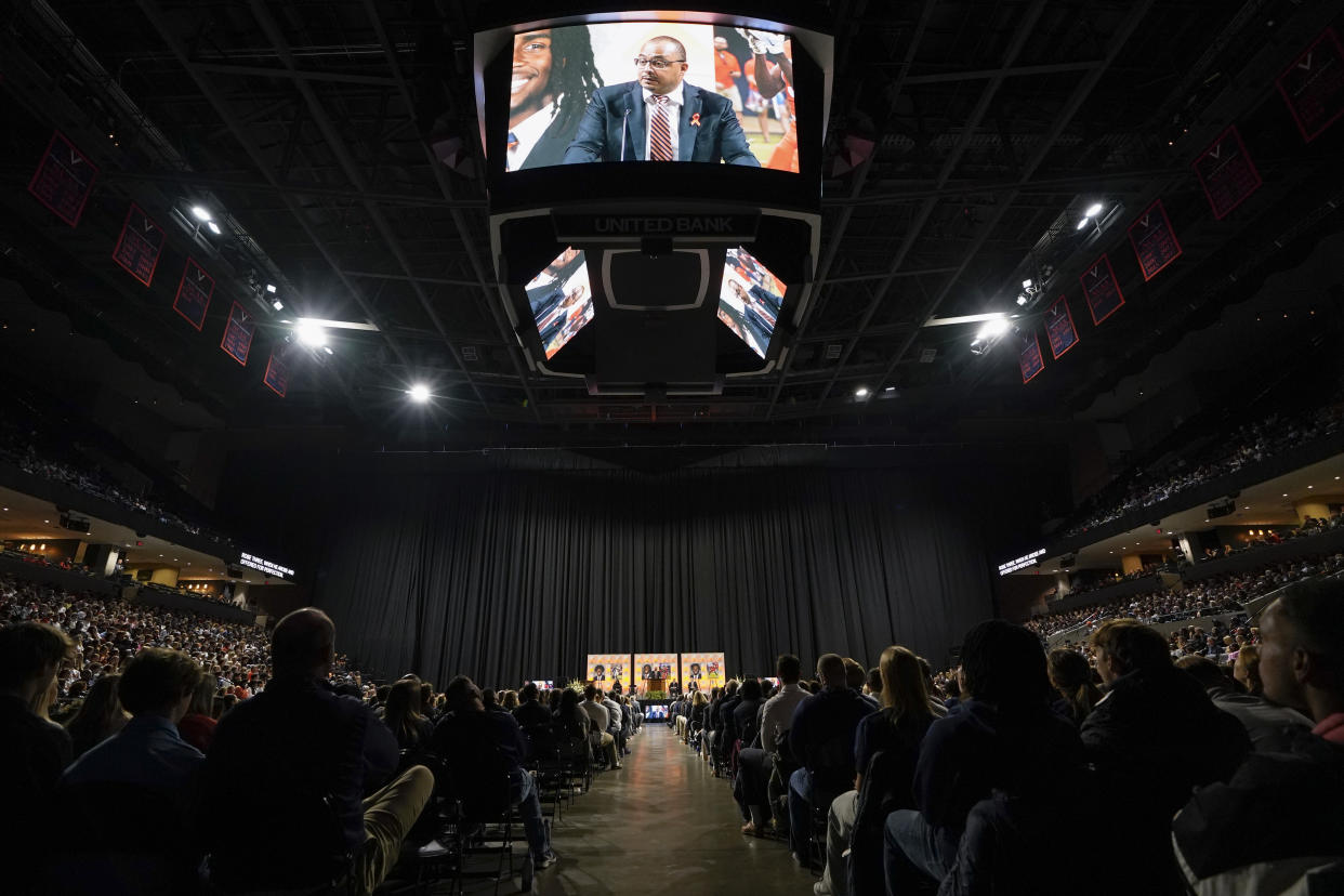 University of Virginia football coach Tony Elliott speaks during a memorial service for three slain University of Virginia football players Lavel Davis Jr., D'Sean Perry and Devin Chandler at John Paul Jones Arena at the school in Charlottesville, Va., Saturday, Nov. 19, 2022. (AP Photo/Steve Helber, Pool)