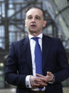 German Foreign Minister Heiko Maas speaks to the media as he arrives for a meeting of EU foreign ministers at the European Council building in Brussels, Monday, Feb 22, 2021. European Union foreign ministers on Monday will look at options for imposing fresh sanctions against Russia over the jailing of opposition leader Alexei Navalny as the 27-nation bloc considers the future of its troubled ties with the country. (Yves Herman, Pool via AP)