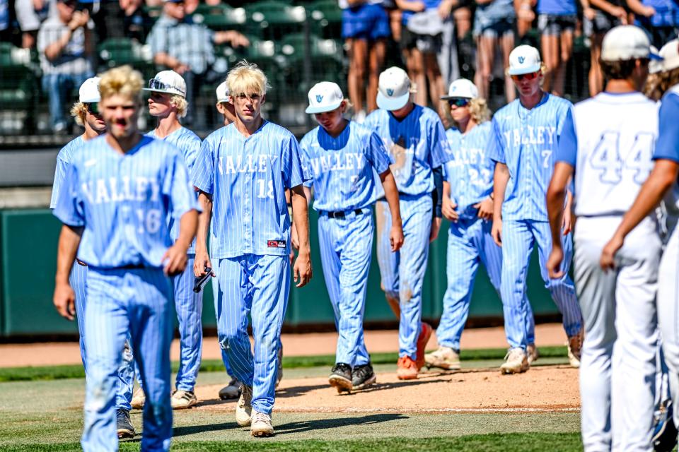 Maple Valley returns to the dugout after a loss to Beal City on Friday, June 14, 2024, during the D4 baseball state semifinal at MSU's McLane Stadium in East Lansing.