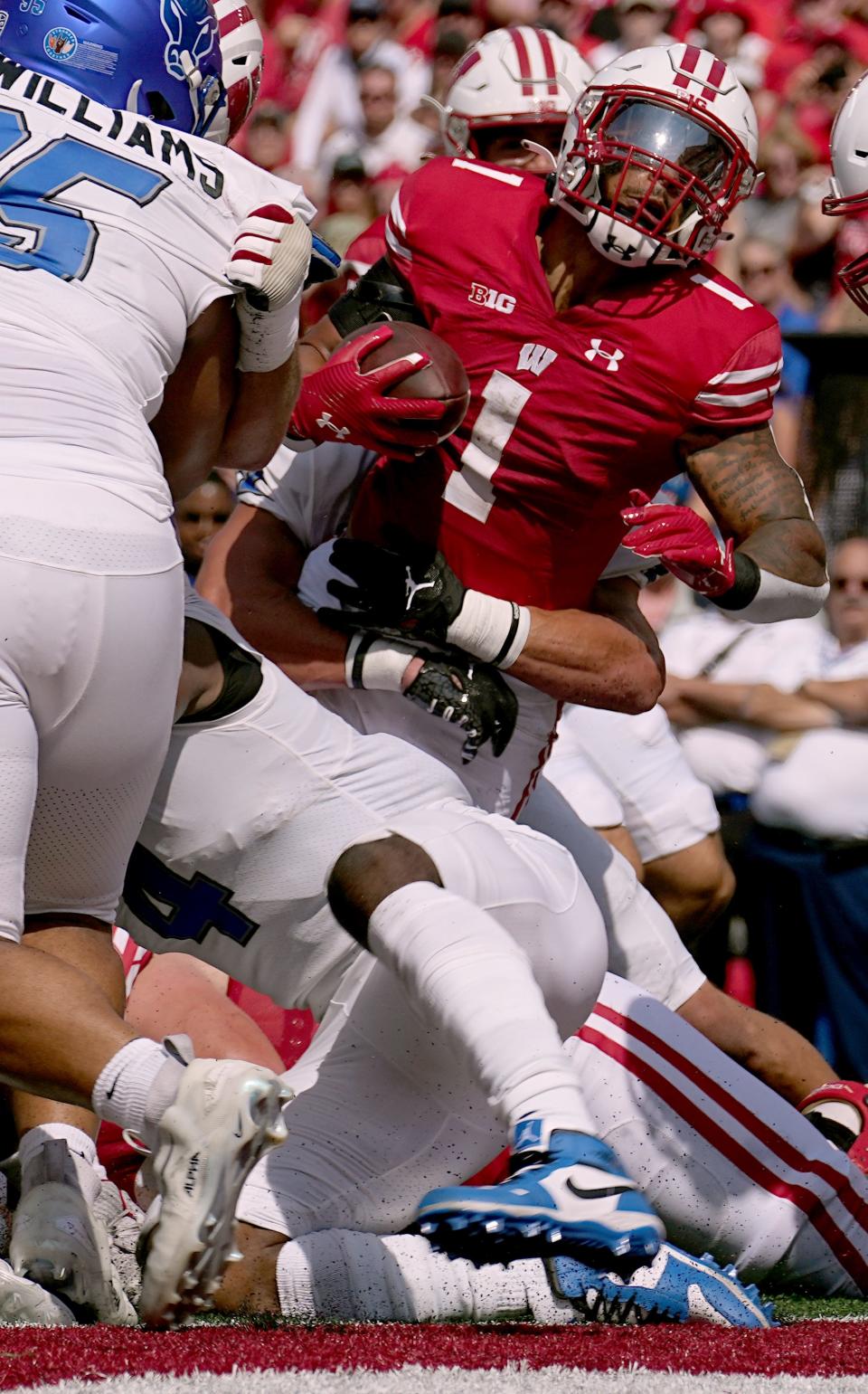 Wisconsin running back Chez Mellusi (1) scores a touchdown during the first quarter of their game against Buffalo Saturday, Sept. 2, 2023, at Camp Randall Stadium in Madison, Wisconsin.