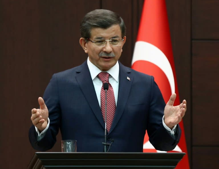 Turkish Prime Minister Ahmet Davutoglu speaks during a joint press conference with German Chancellor Angela Merkel in Ankara on February 8, 2016