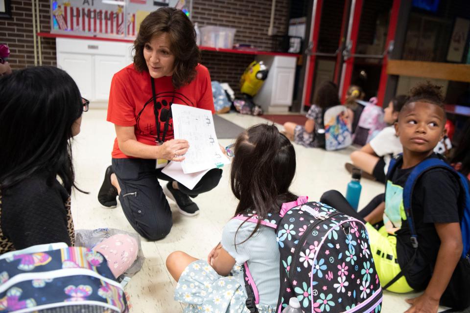 Linden Elementary School teacher Stephanie Smith chats with students during their first day back from break on Monday, July 24, 2023.