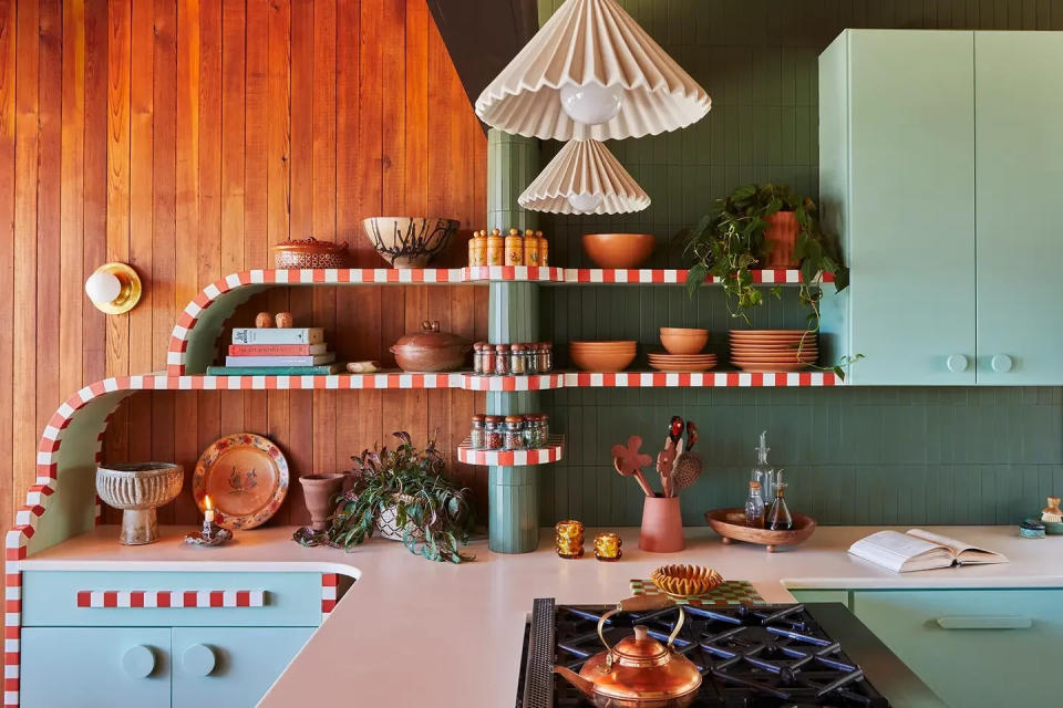 Kitchen with handpainted stripes along trim of shelves