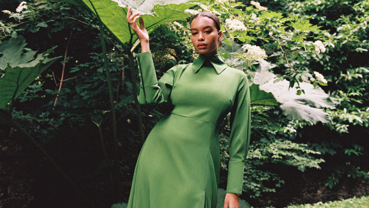 The green dress photographed next to the large Gunnera leaves which inspired its creation