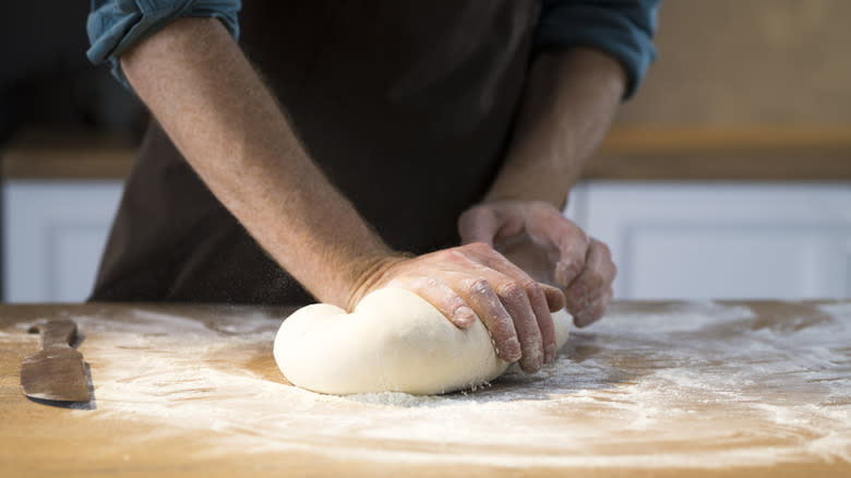 kneading pizza dough