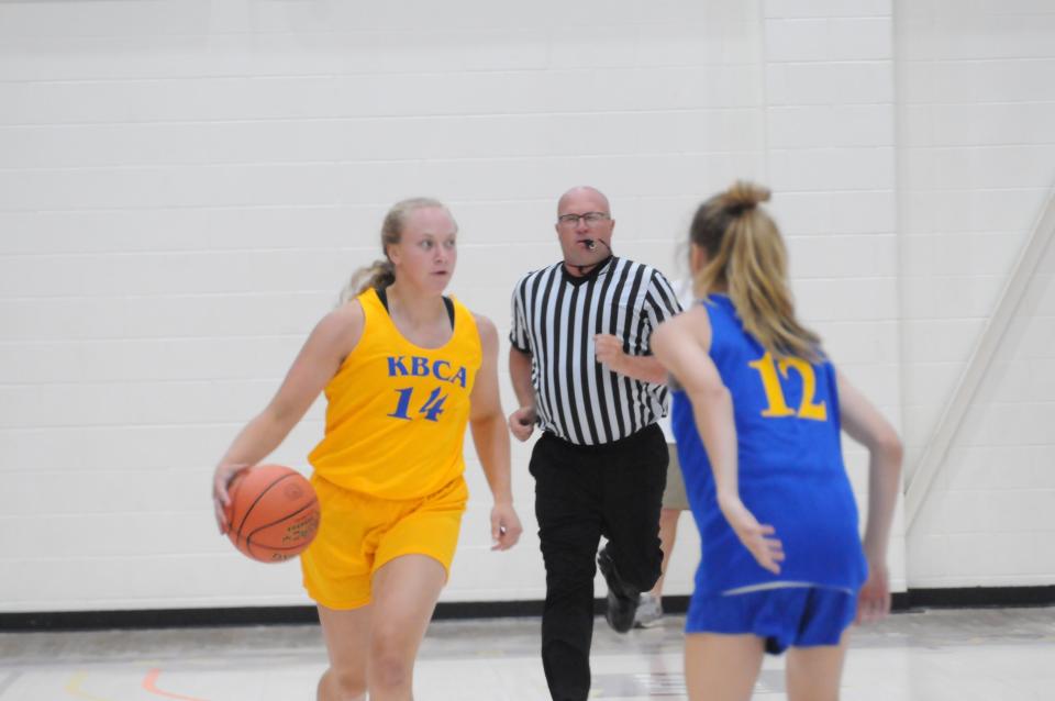 Eudora's Harper Schreiner (14) dribbles the ball while being defended by Haven's Reese Roper (12) during the KBCA All-Star Game Saturday, June 18, 2022 at Mabee Arena in Salina.