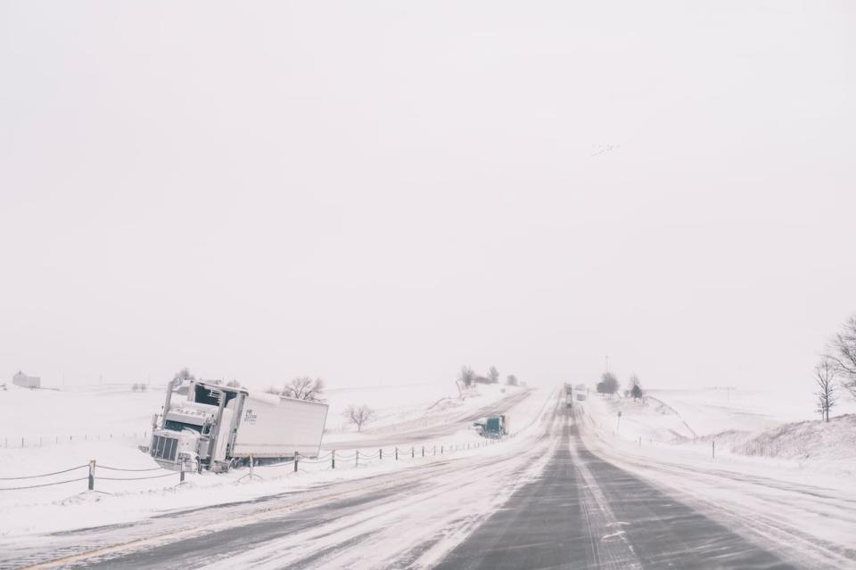 There were dozens of scenes like this across Iowa over the weekend as numerous trucks and cars crashed off highways, with a blizzard and Arctic conditions forcing numerous campaign events to be cancelled.