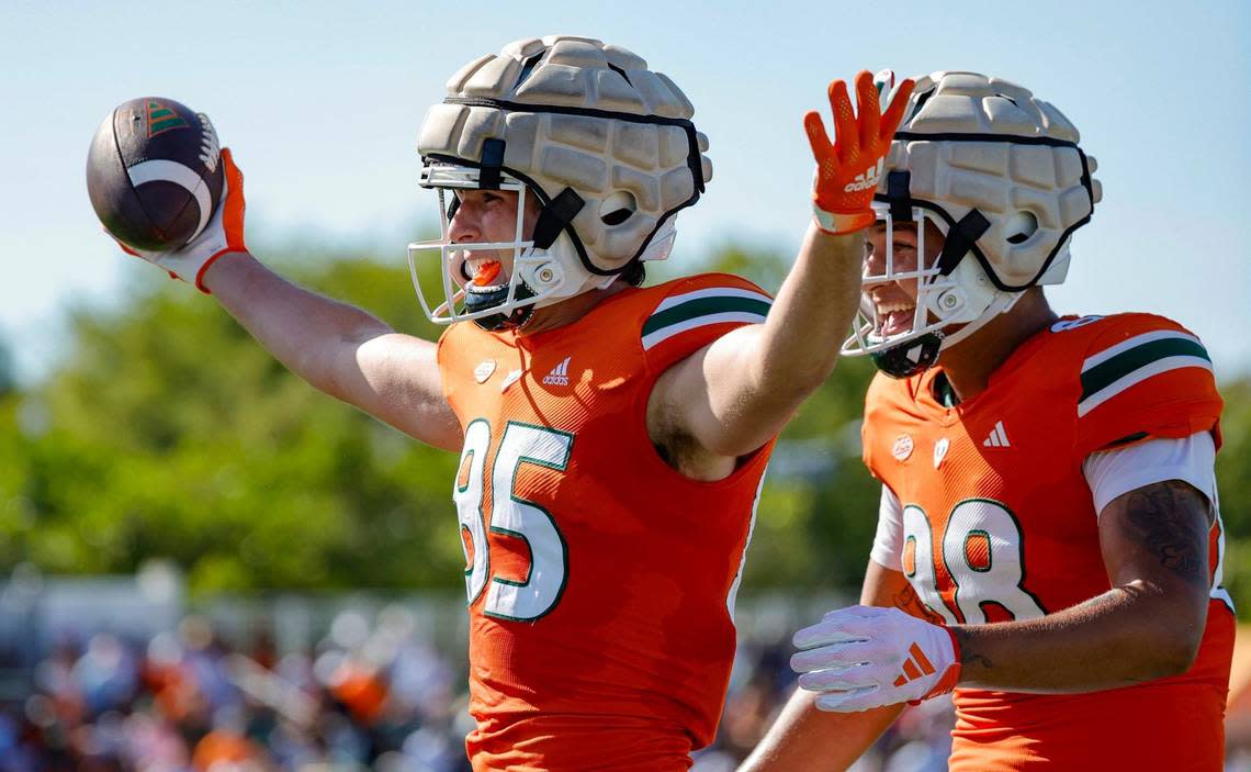 Miami Hurricanes tight end Jackson Carver (85) and tight end Riley Williams (88) celebrate in the end zone after Carver scores in the second quarter during the Canes spring football game at the University of Miami’s Cobb Stadium in Coral Gables, Florida on Saturday, April 13, 2024.