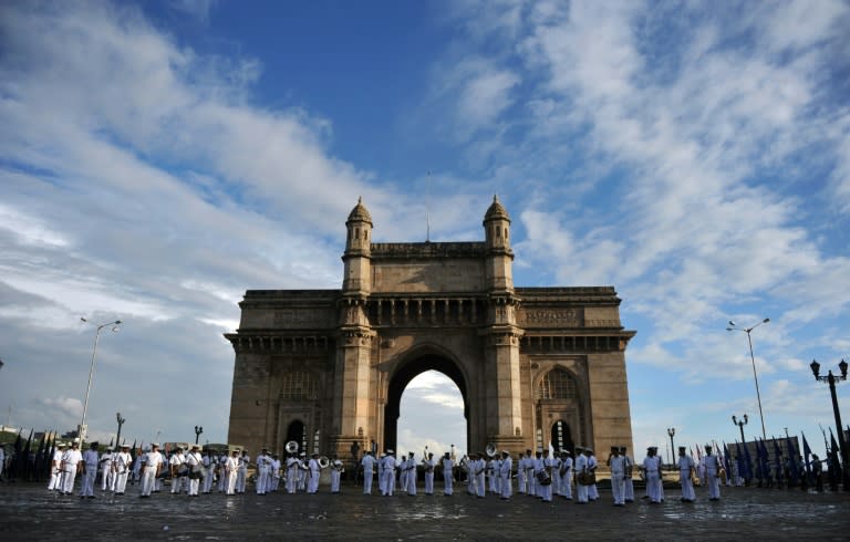 Navy cadets take part in a rehearsal in front of the landmark Gateway of India near the Taj Mahal Palace Hotel (unseen) in Mumbai on November 24, 2010