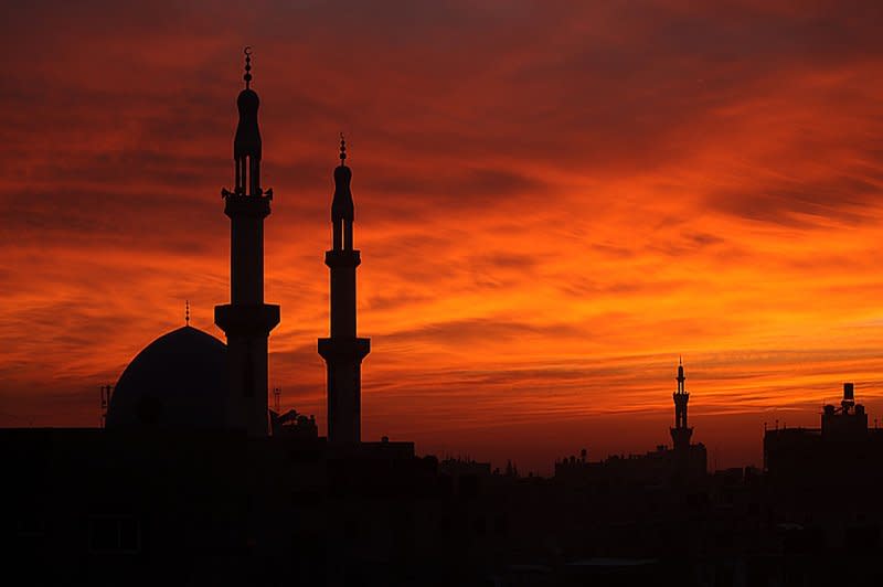 An emergency meeting of a special session of the U.N. General Assembly is set to vote Tuesday on a resolution calling for an immediate cease-fire in Gaza. The minarets of a mosque are silhouetted against the sky at sunset in the southern Gaza Strip on Sunday, December 10, 2023. Photo by Ismael Mohamad/UPI