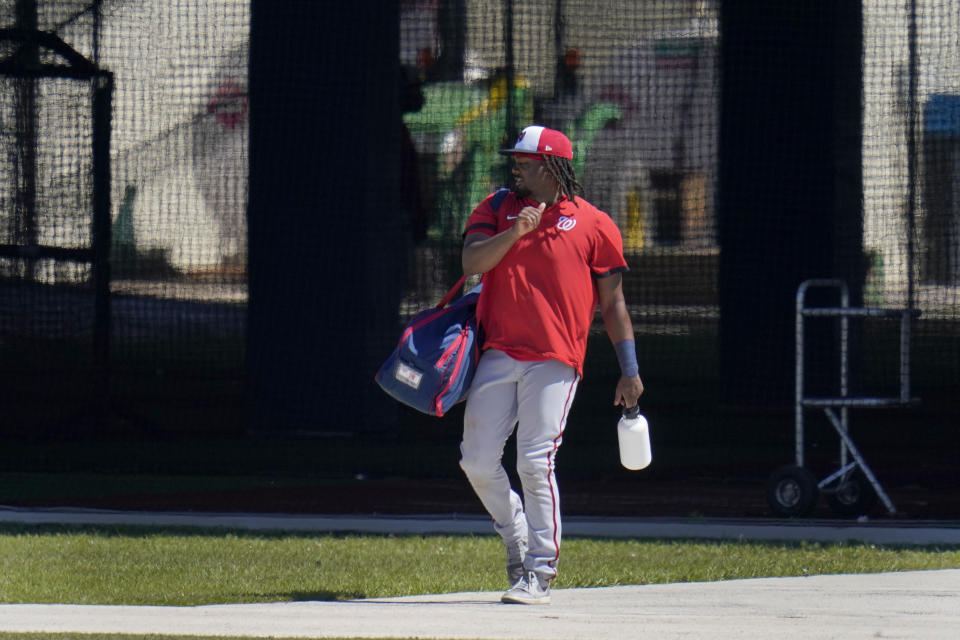 Washington Nationals' Josh Bell leaves the batting cages during spring training baseball practice Thursday, Feb. 25, 2021, in West Palm Beach, Fla. (AP Photo/Jeff Roberson)