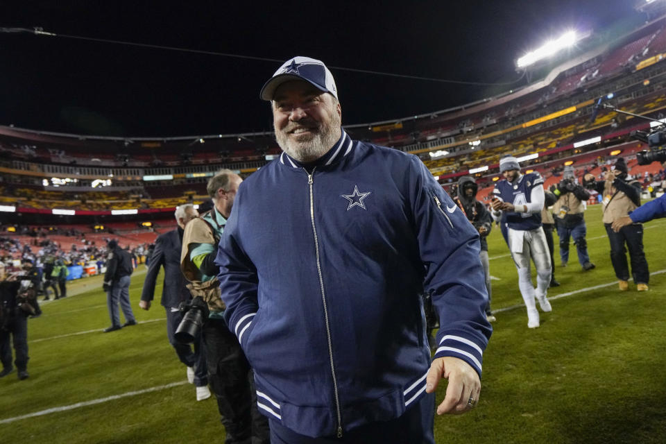 Dallas Cowboys head coach Mike McCarthy smiles as he walks off the field at the end of an NFL football game, Sunday, Jan. 7, 2024, in Landover, Md. Dallas won 38-10. (AP Photo/Jessica Rapfogel)