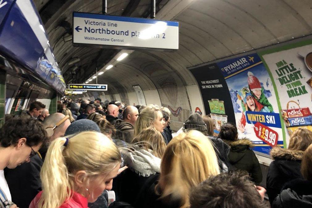 Disruption: Commuters wait to board packed trains on the Piccadilly line: @LoweFraser/Twitter