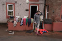 Residents begin to clean up their homes in the flooded streets in Appleby-in-Westmorland, Cumbria. (PA)