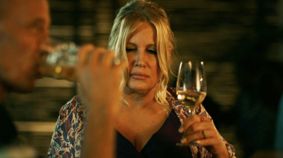 Tanya drinking wine with Greg in Season 1