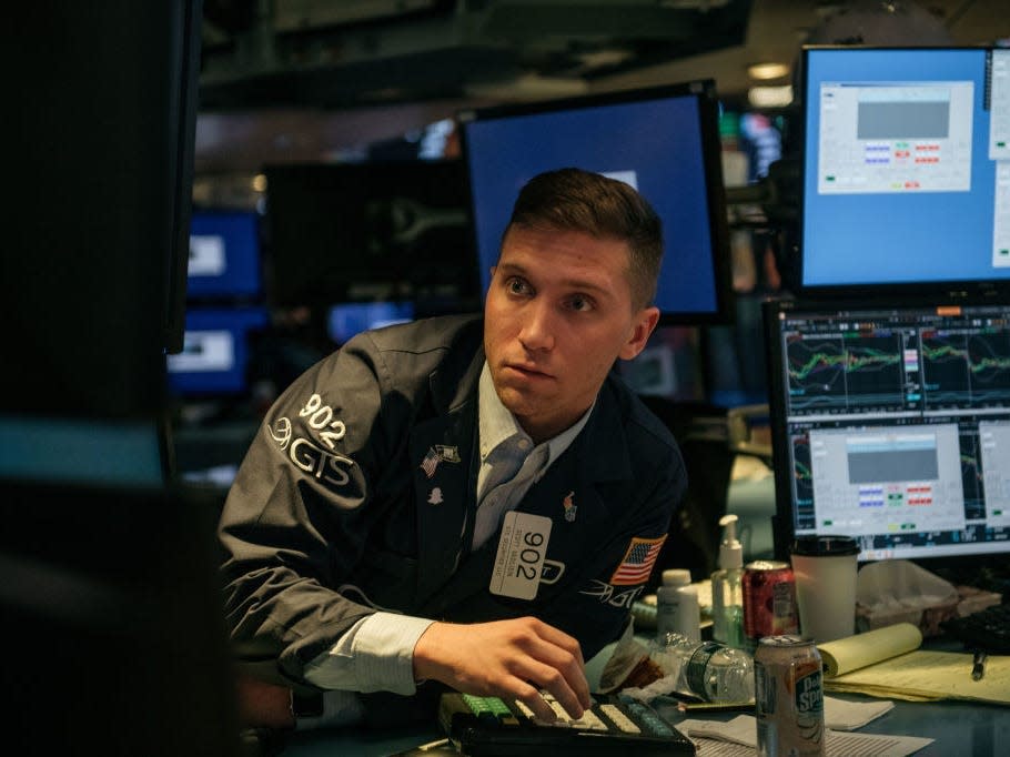 Traders work on the floor of the New York Stock Exchange