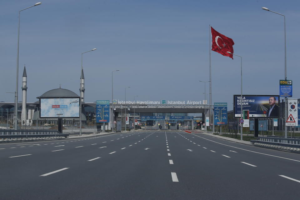 An empty road leading to Istanbul Airport, Sunday, April 19, 2020, on the second day of the two-day curfew declared by Turkey's government in an attempt to control the spread of coronavirus. (AP Photo/Mehmet Guzel)