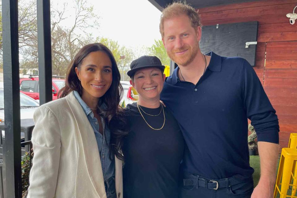 <p>Cory Rivademar/@coryriv/@labarbecue</p> Prince Harry and Meghan Markle pose with Allison "Ali" Clem, la Barbecue owner/operator