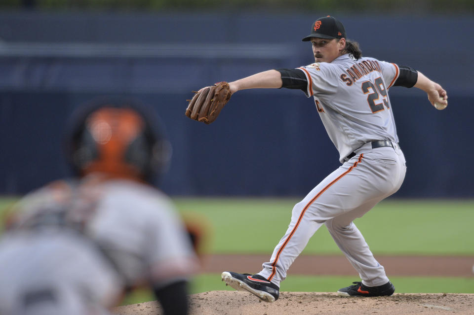 San Francisco Giants starting pitcher Jeff Samardzija, right, works against a San Diego Padres batter during the first inning of a baseball game Friday, July 26, 2019, in San Diego. (AP Photo/Orlando Ramirez)