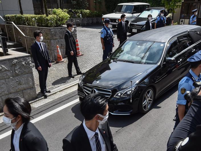 A hearse transporting the body of former Japanese prime minister Shinzo Abe arrives at his residence in Tokyo on July 9, 2022.