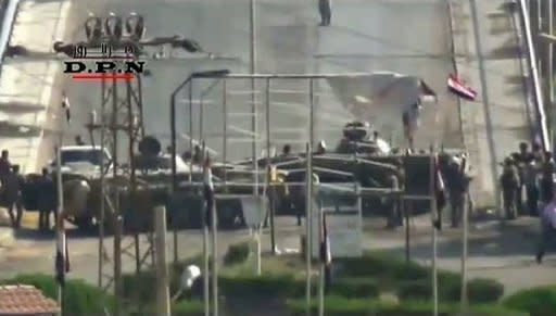 An image taken from a video on YouTube, which cannot be verified, shows Syrian tanks deployed on a bridge in the eastern Syrian city of Deir al-Zor on August 7. Turkey and Russia have been piling new pressure on Syria to end its deadly crackdown on protests as the death toll mounts with activists saying security forces have killed at least 25 people