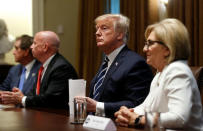U.S. President Donald Trump sits between Rep. Kevin Brady (R-TX) and Rep. Diane Black (R-TN) after speaking about his summit with Russia's President Vladimir Putin at the start of a meeting with members of the U.S. Congress at the White House in Washington, July 17, 2018. REUTERS/Leah Millis