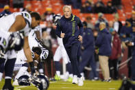 Seattle Seahawks head coach Pete Carroll running on the field to greet his players prior to the start of the first half of an NFL football game against the Washington Football Team, Monday, Nov. 29, 2021, in Landover, Md. (AP Photo/Julio Cortez)