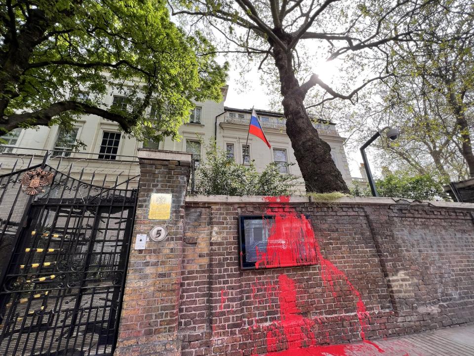 Red paint appears on the wall of the Russian embassy in London, UK.