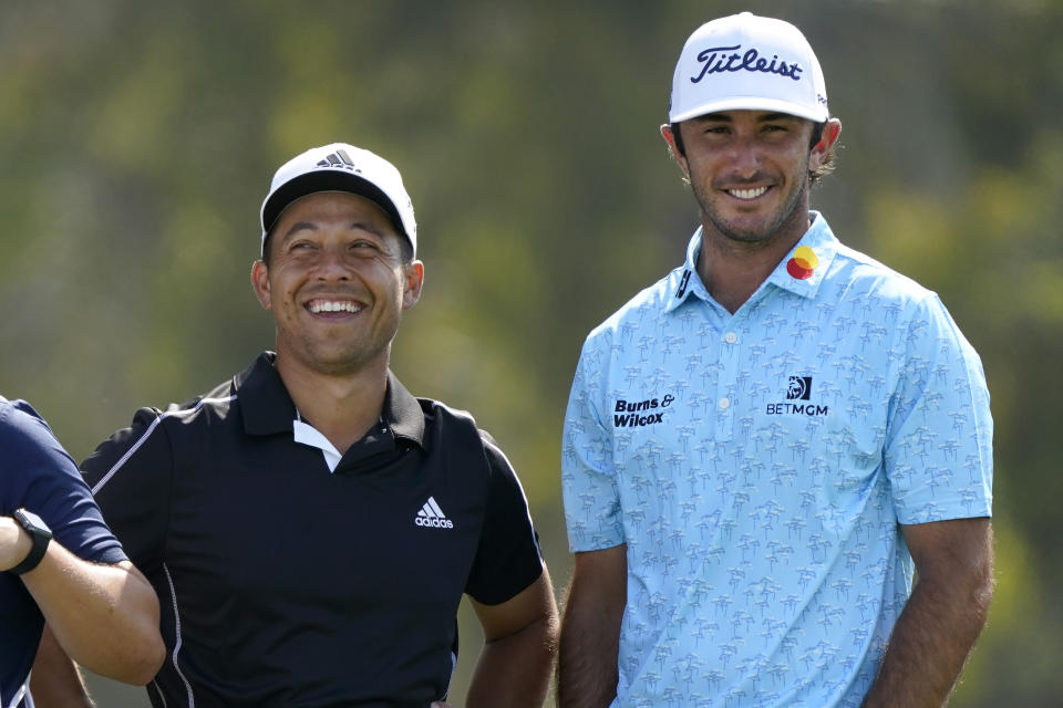 Xander Schauffele, left, and Max Homa laugh on the 12th tee during the first round of the U.S. Open Golf Championship, Thursday, June 17, 2021, at Torrey Pines Golf Course in San Diego. (AP Photo/Marcio Jose Sanchez)