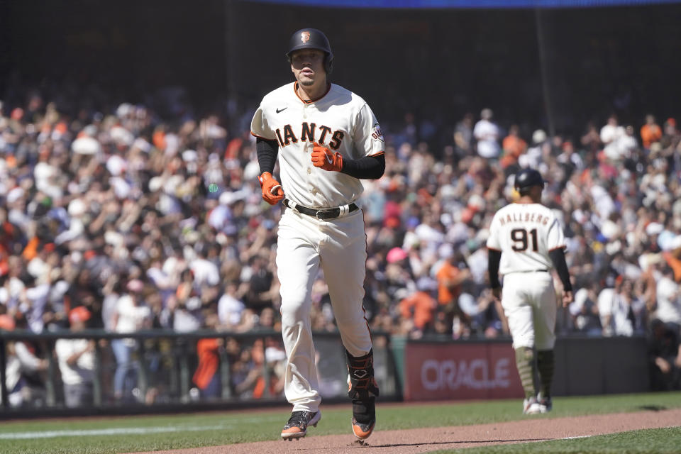 San Francisco Giants' Wilmer Flores rounds the bases after hitting a home run against the San Diego Padres during the eighth inning of a baseball game in San Francisco, Saturday, May 21, 2022. (AP Photo/Jeff Chiu)